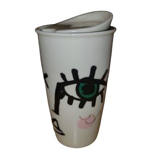Starbucks abstract face woman wink eyes tall mug coffee lid gold black white